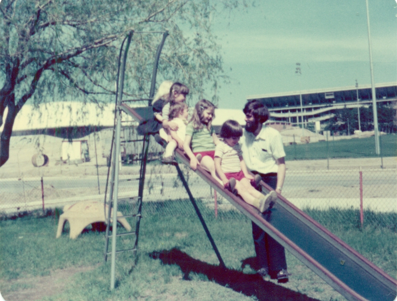 Color picture of children going down a slide.